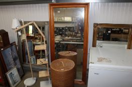 A modern pine framed wall mirror