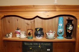A collection of various decorative items to include glass floral decorated vases, a Torquay