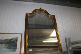 A gilt framed bevel edged wall mirror