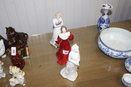 A Coalport figurine 'Ladies of Fashion Caroline' together with two Royal Doulton figurines, '