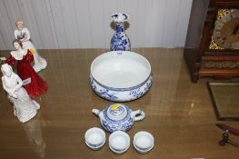 A blue and white Oriental vase having floral decoration together with an Oriental blue and white