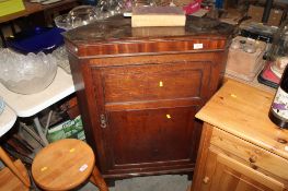 An oak corner cabinet