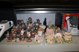 A collection of Lilliput Lane model cottages and a quantity of Blarney figures