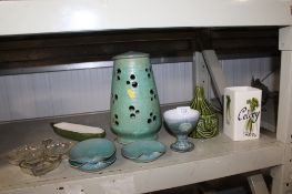 A collection of various decorative items to include a Sylvac cucumber storage jar, a celery vase,