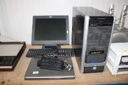 A Dell laptop and charger; IBM monitor; Cooler Master Computer - lacking lead and keyboard - all