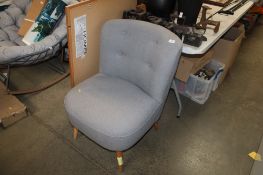 A modern grey upholstered chair