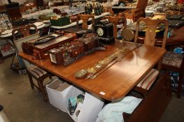 A reproduction twin pillar extending dining table with one extra leaf together with set of four