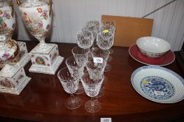 A set of six Waterford cut glass wine glasses with fluted stems and a set of six Waterford cut glass