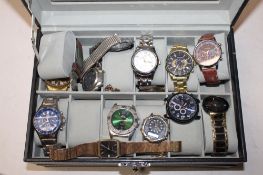 A jewellery box containing various wristwatches to include Slazenger, Geneva, silver coloured