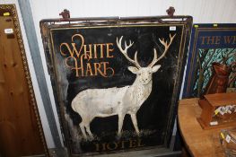 A wooden painted 'White Hart' pub sign