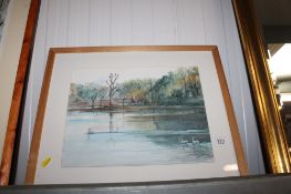 A framed and glazed watercolour study depicting a river scene