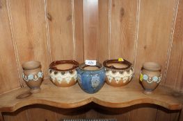 A pair of Doulton Lambeth 'Silicone' ware vases having floral decoration and a pair of Royal Doulton