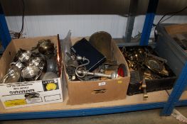 Three boxes containing various metalware, brass jugs, silver plated candelabra etc.