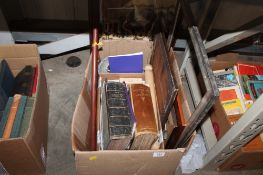 A box of various boos, pictures frames etc.