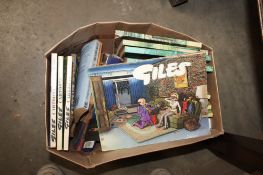 A box containing various books to include Giles annuals