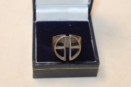 A silver geometric signet ring makers mark JR approx. 9.5gms