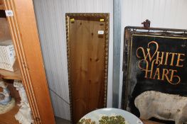 A gilt framed oblong wall mirror