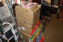 Three boxes of pink velvet clothes hangers