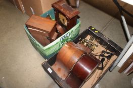Two boxes containing various mantel clocks and parts