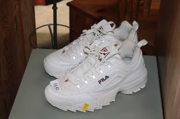 A pair of Fila white trainers, size 9
