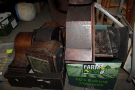 Two boxes containing various wooden cased mantel clocks