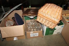 Three boxes containing various glassware and a wicker hamper