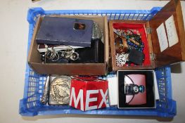 A box containing various costume jewellery to include necklaces, brooches, wristwatches,
