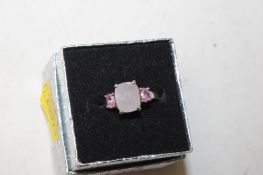 A 925 silver ring set with pink stones