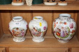 A pair of porcelain floral decorated transfer printed vases, decorated with courting couples, marked