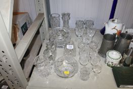 A quantity of various table glassware to include cut glass vases, decanter and stopper, wine glasses