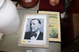A framed and glazed coloured print together with a photographic print of Noel Coward