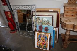 A collection of various pictures, prints and mirrors