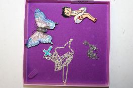 A Sterling silver and enamel brooch in the form of a butterfly; a 925 silver chain hung with pendant
