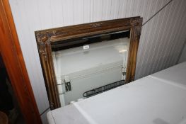 A gilt framed and bevel edged wall mirror