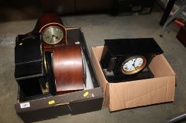 Two boxes containing various mantel clocks to include black slate style examples