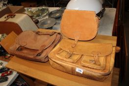 A leather cartridge style bag together with two leather satchels