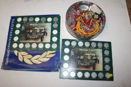 A box containing various costume jewellery, bead necklaces brooches and a collection of coins
