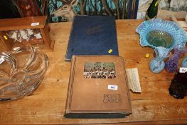A scrap album and contents together with a postcard album and contents