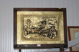 A brass embossed fire screen