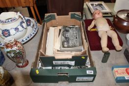 Two boxes containing various black and white photographs