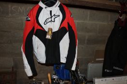 An Alpinestars white, red and black large motorcycle jacket