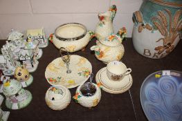A collection of Clarice Cliff 'Harvest' pattern teaware and a Clarice Cliff Coronation commemorative
