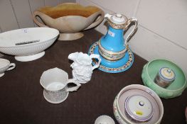 A continental porcelain ewer on stand; a Parian type relief moulded jug and similar mug