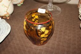 An amber Art Glass baluster vase with enamel decoration