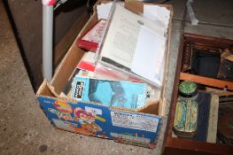 A box of various ephemera to include postcards, catalogues, photographs, signed postcards etc.