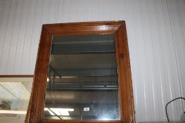 A pitch pine framed wall mirror