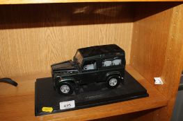 A die-cast model of a Land Rover Defender 90 AF