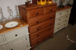 A modern pine chest fitted two short over four long drawers
