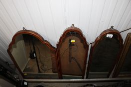 A set of three mahogany framed wall mirrors