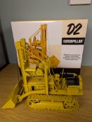 An ACMOC USA 1:16 Caterpillar D2 Track-Type Tractor (5U Series) Traxcavator with original box. 2005.